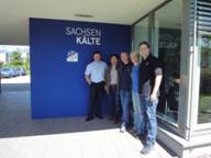 Sachsen Kalte group of employees outside of building